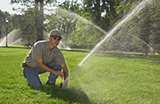 Daly City sprinkler repair technician finishes a job